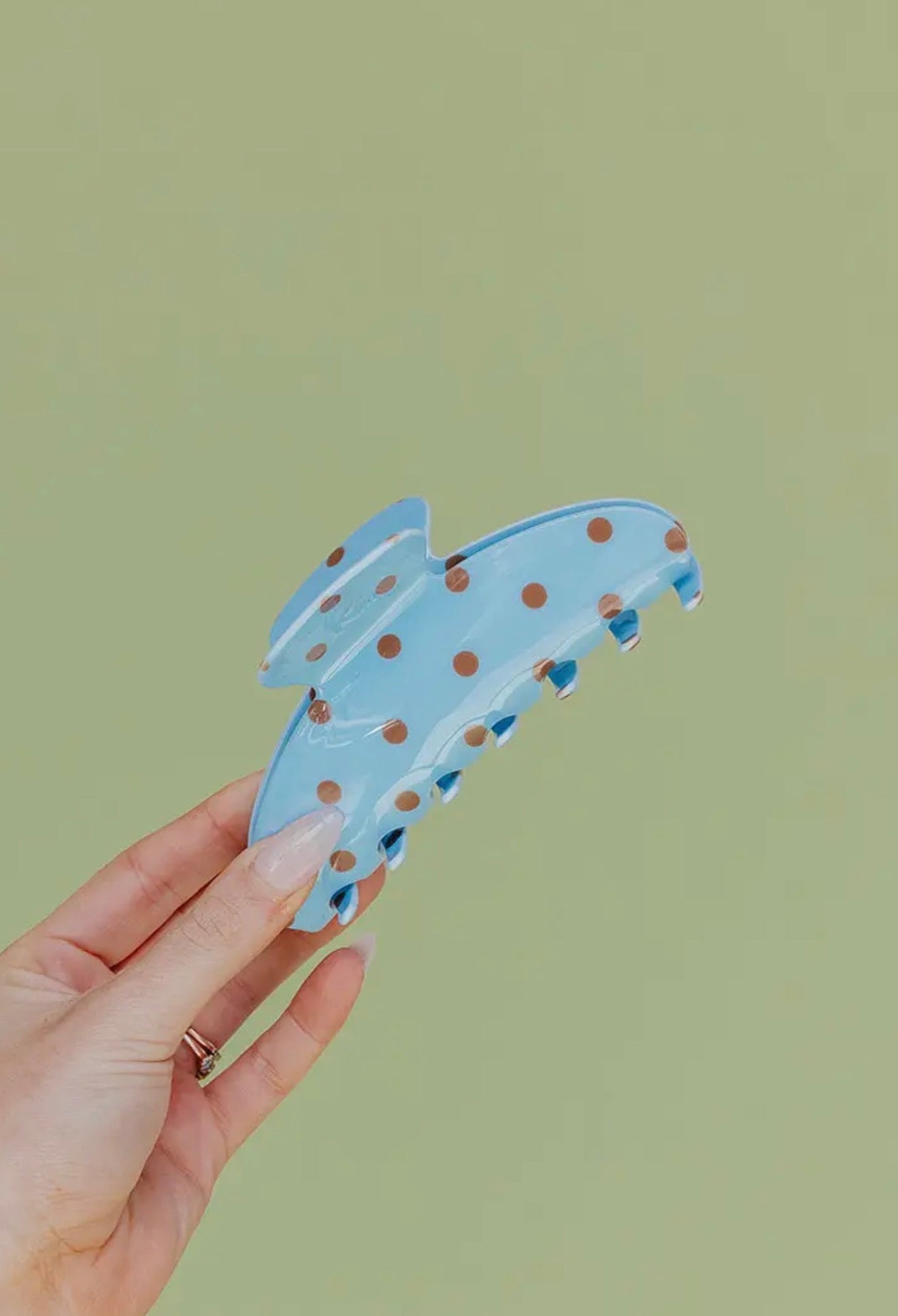 brown and blue polka dot claw clip